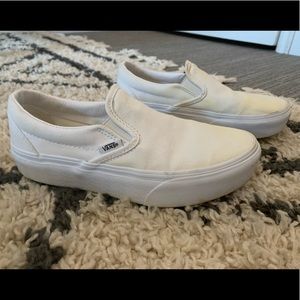 White platform slip on vans